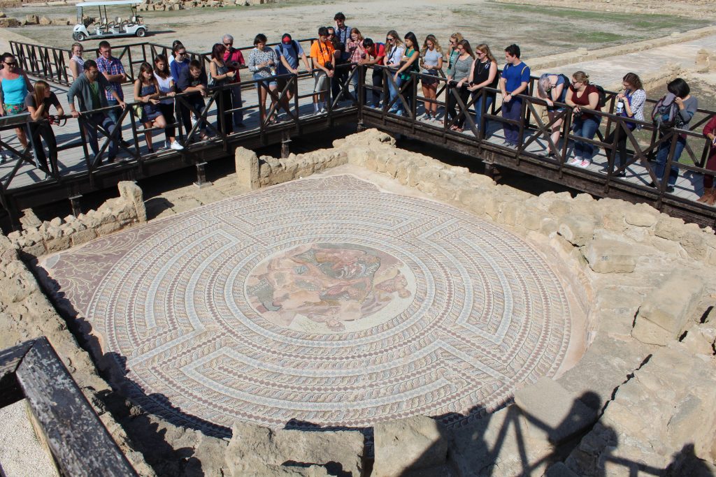 Optional Trips: Last but not Least...Cyprus The group surrounds the preservation of a large floor mosaic made of painted tiles.